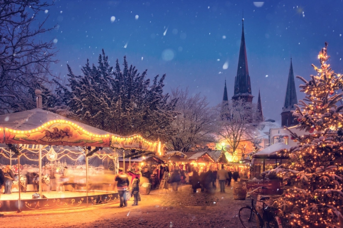 romantic winter breaks Bavaria christmas market at night christmas tree festive lights snow