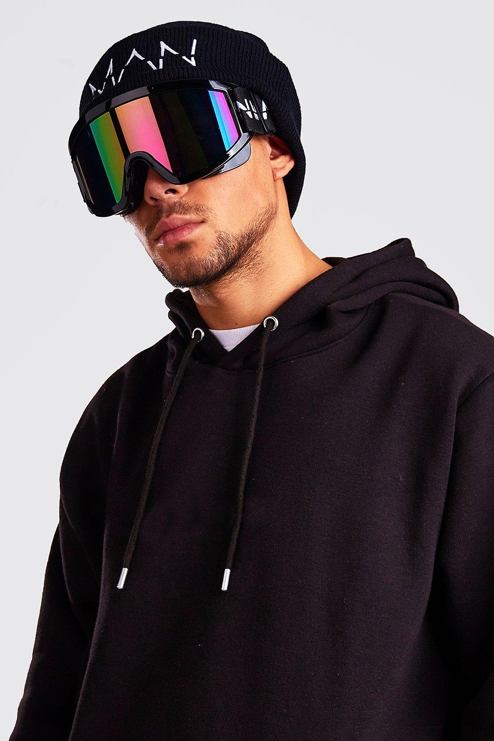 Ski wear trends man with extra large ski googles black hoodie and hat