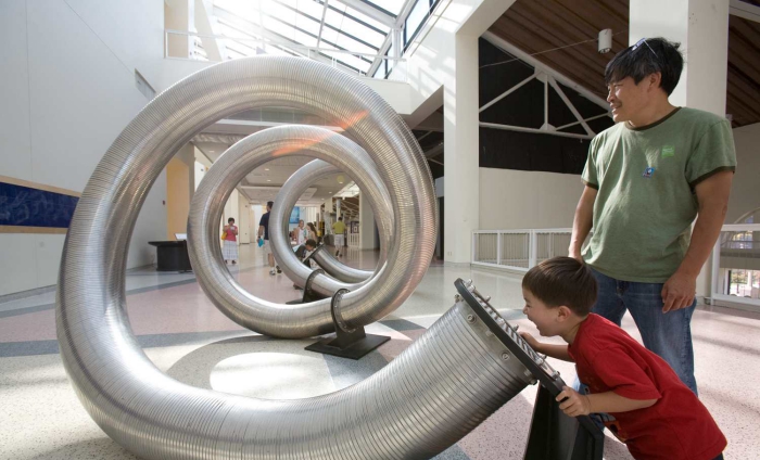 Science center Los Angeles father and son exploring the exhibition