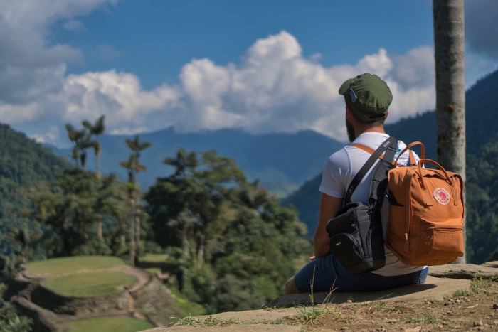 Man with a backpack looking at the lost city Colombia ciudad perdida