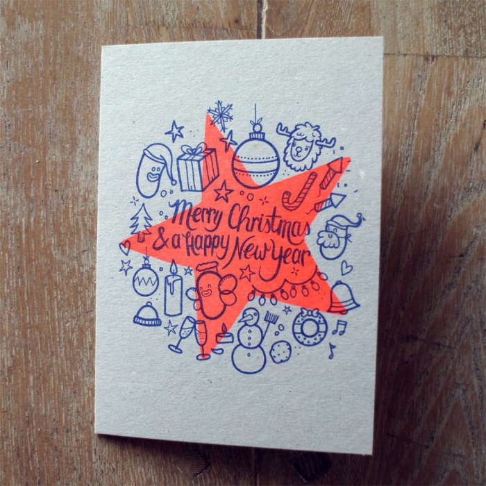 christmas card with overlapping patterns on a wooden surface