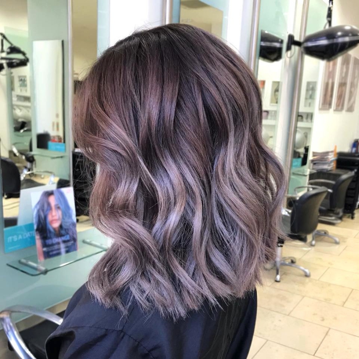 Balayage hair colors lilac woman profile in hair studio middle length waves 