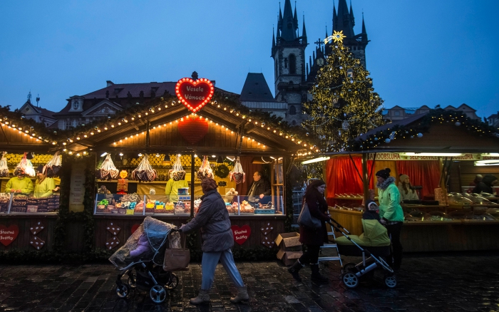 Christmas market in Prague decorated stands in the evening moms with strollers