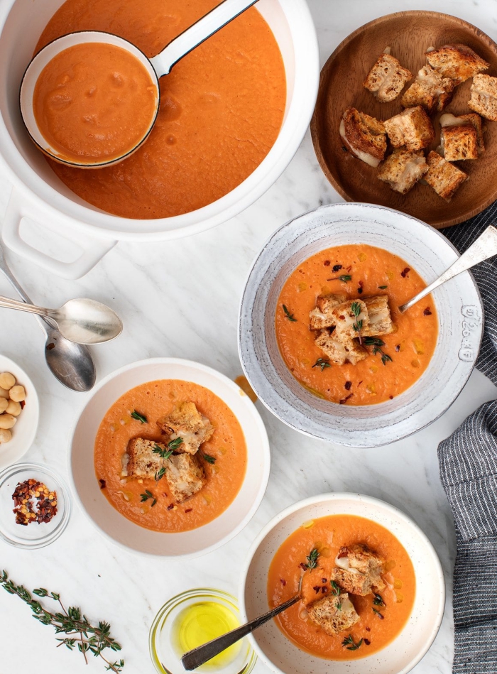 Creamy tomato soup for vegans with crutons on a table