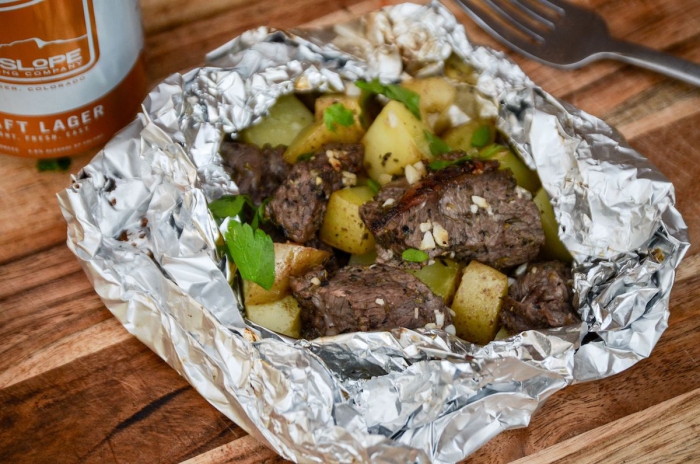 Roast beef wrap beef with vegetables wrapped in aluminum foil