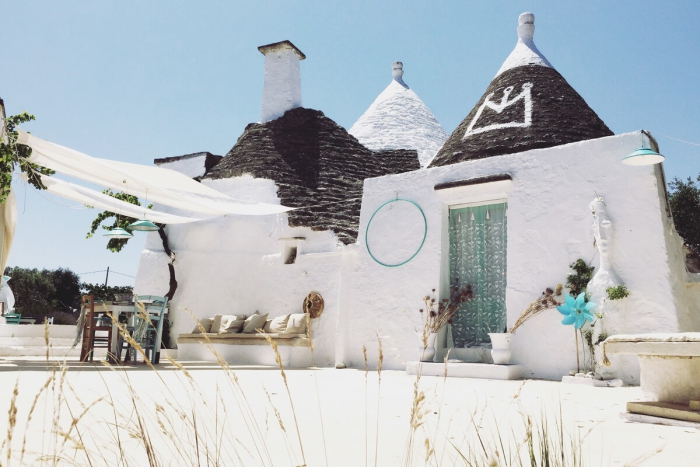 white trullo houses authentic back yard 