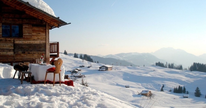 Best cabins for winter break in France snowy landscape and slopes dining table outside