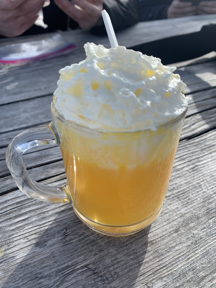 Hot winter drink on a table egg punch with cream 