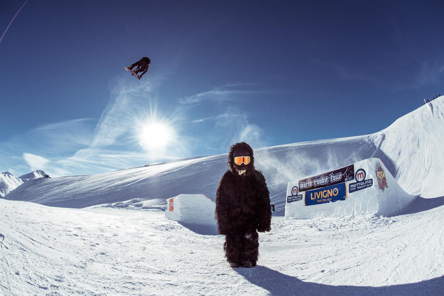 Livigno ski resort snowy landscape with people snowboarding winter sports