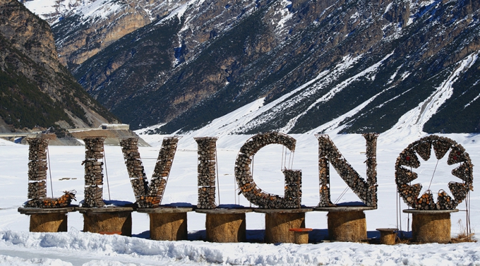 Livigno ski resort welcome sign stones mountain landscape