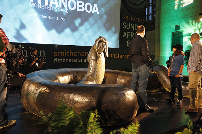 Titanoboa snake replica with people monster snake eating crocodile
