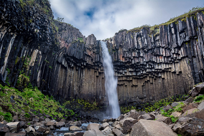 Iceland Nature waterfall high black rocks formations