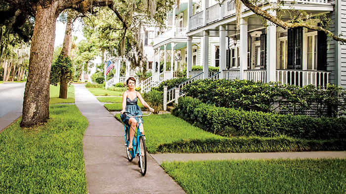 benefits in living in a small town girl riding a bicycle on a lane 