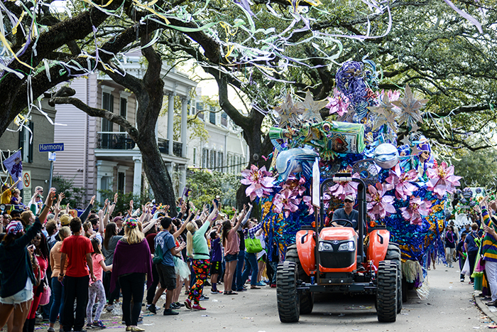 Mardi Gras events in America decorated tractor street crowd 