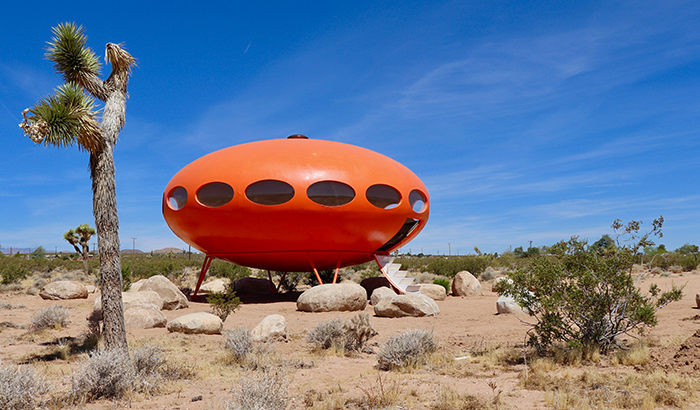 bright orange futuro house in the desert mobile home