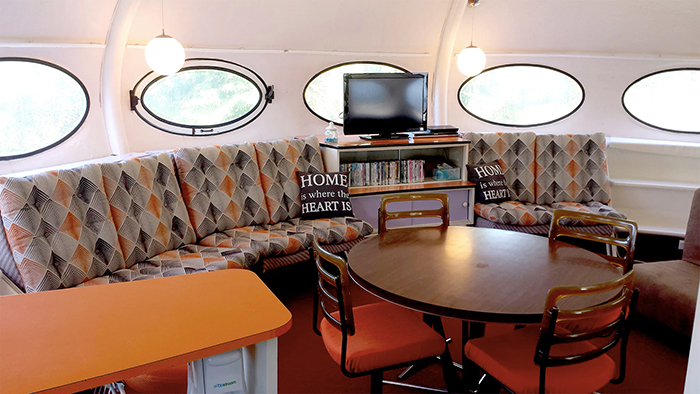 Futuro house interior sofa dining table chairs round windows