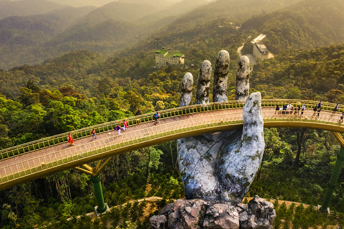 hand bridge Vietnam view from above people one hand green hills