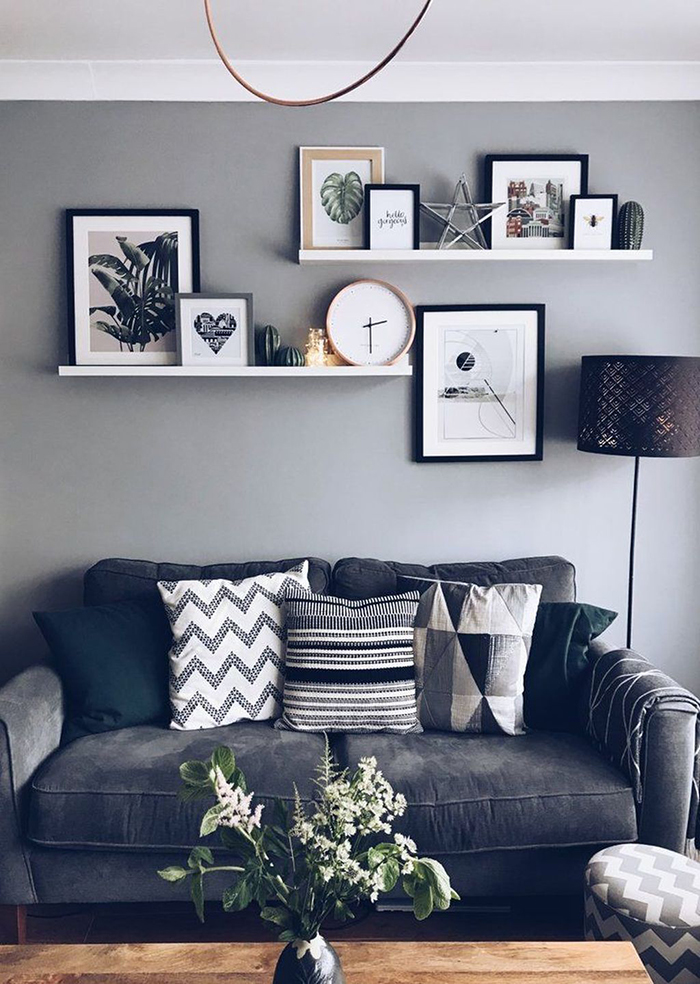 Neutral look black white and grey photo wall shelves photo frames living room design trend