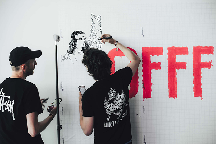 OFFF Music Art Festival Spain artists paining on a white wall