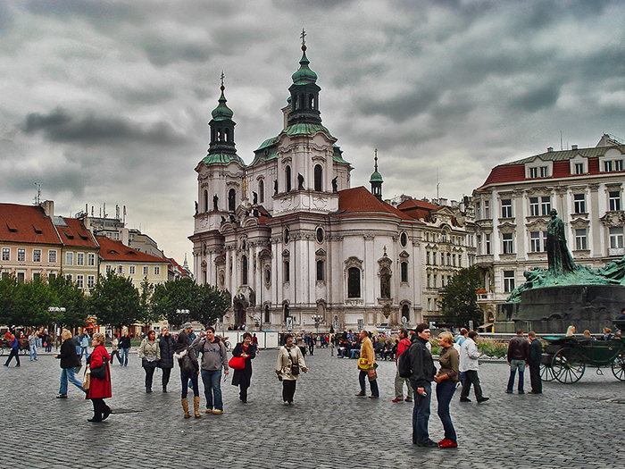 Buildings in Prague busy square tourists Czech capital beautiful buildings