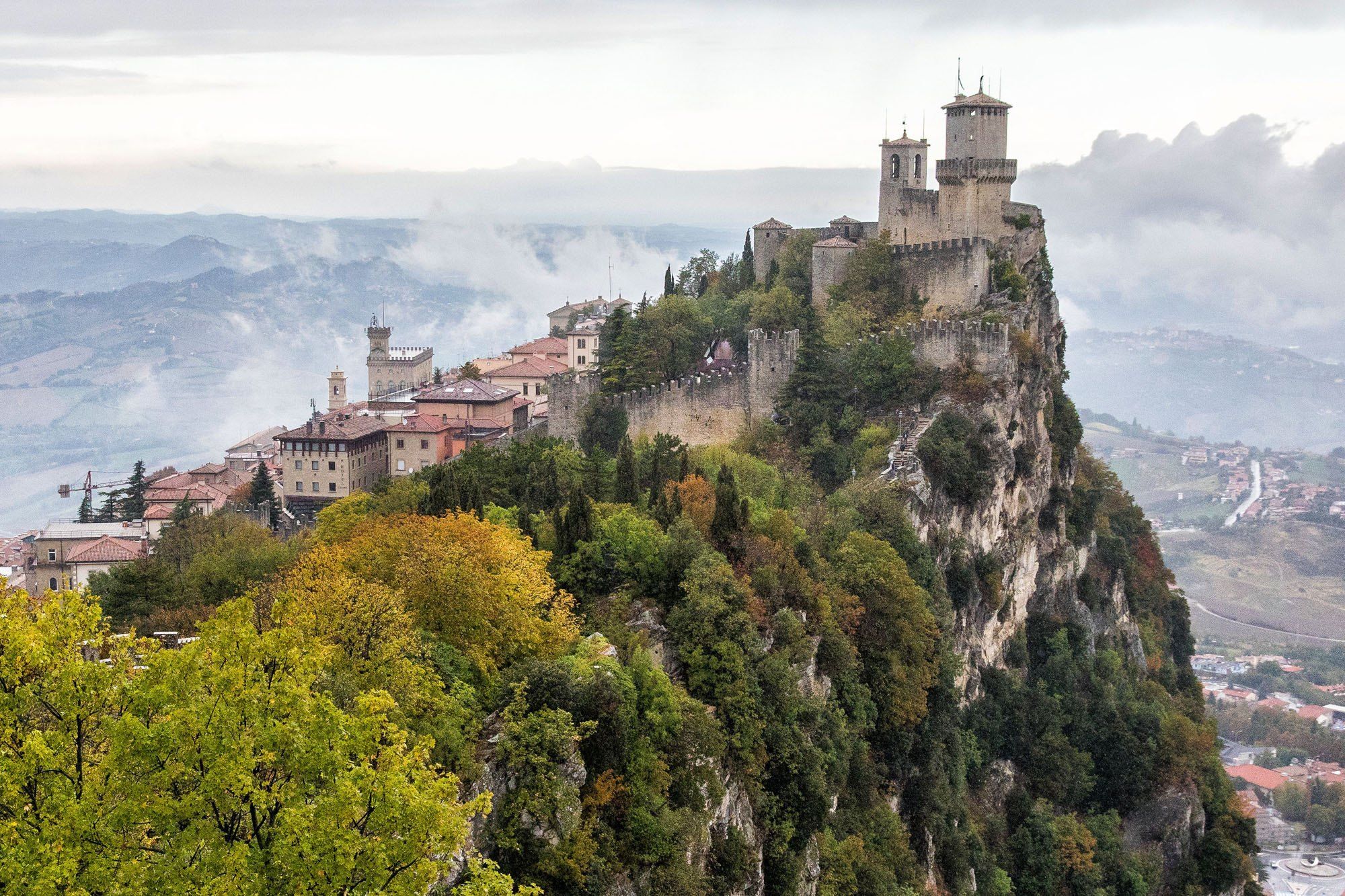 San Marino castles the view on the hill top fortress old monastery in clouds