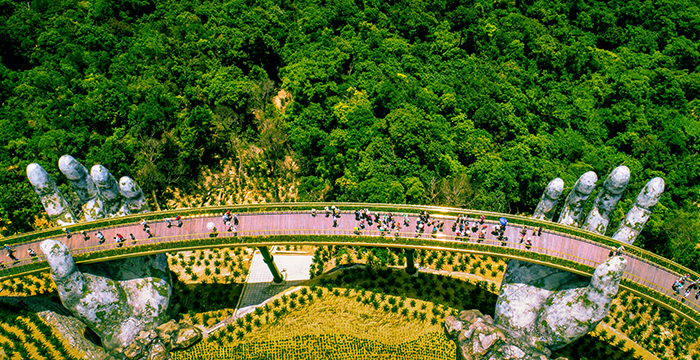 Golden Bridge Vietnam hand bridge view from above tourists on a bridge