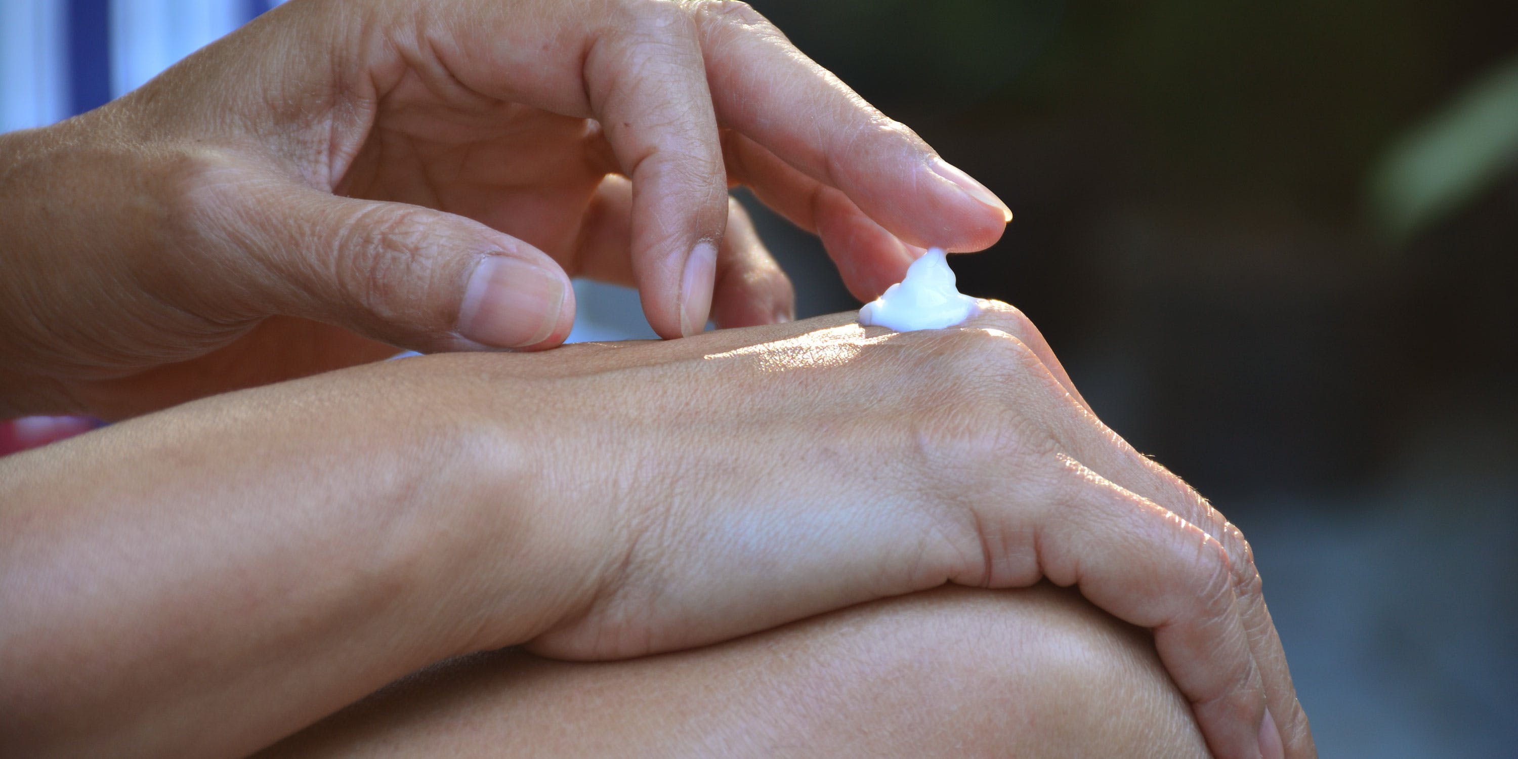 Woman having CBD cream on her hand