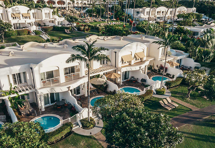 Fairmont Kea Lani Best resorts Hawaii white buildings round pools palm trees exotic garden