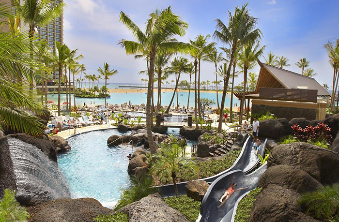 Top 5 Hawaii Resorts Outdoor pool palm trees water park Hilton Hawaii Village