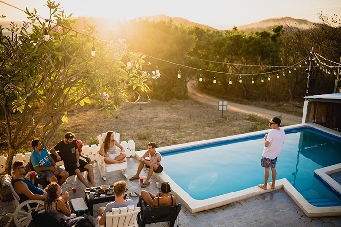 Summer vacation 2020 outdoor activities pool party friends at the pool outdoor lights sunset