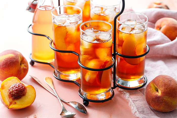 Pretty Iced Tea Refreshing Summer Drinks Peaches in tall glasses on a table