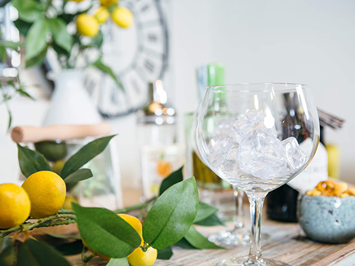 refreshing summer drinks ideas empty glass with ice on a table with lemon decor 