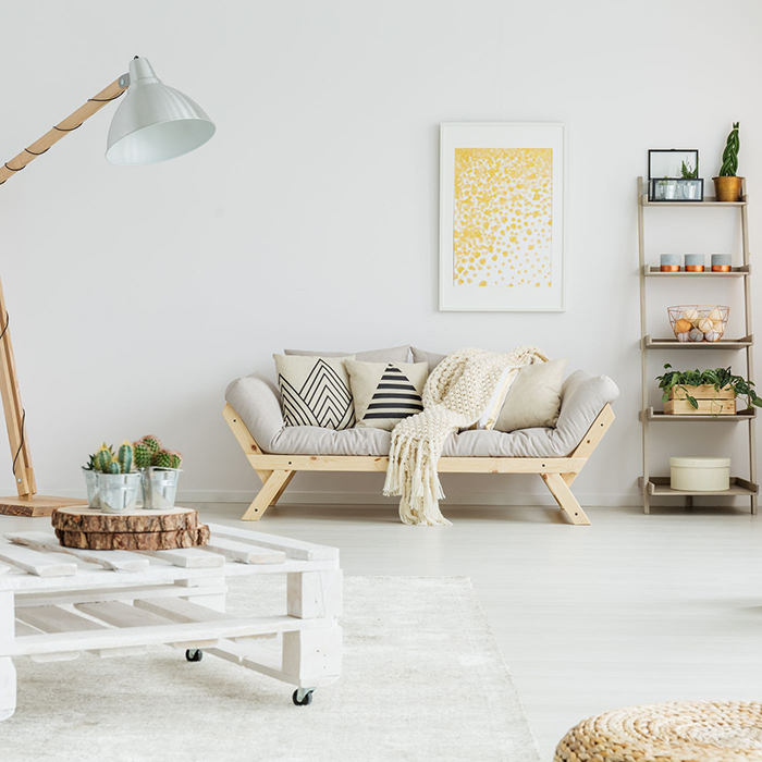 recycled furniture summer inspiration white minimal living room with a wooden couch white table and green plants