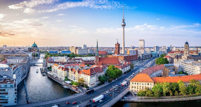 view of Berlin with a river and a tall tower