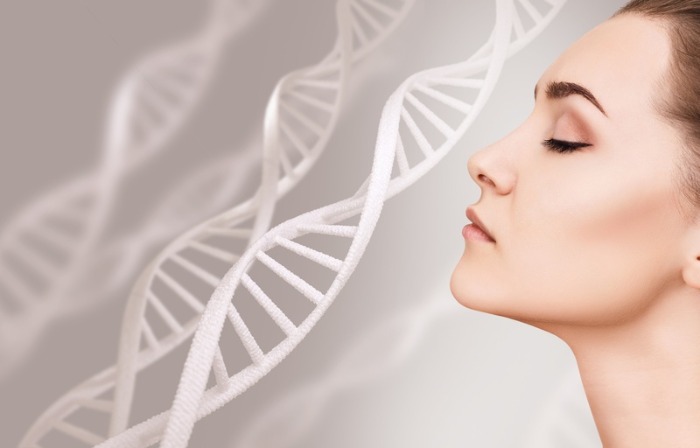 woman on a gray background with DNA spirals 