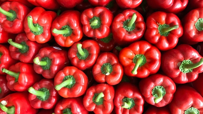 red bell peppers with green stems viewed from above