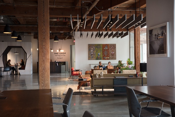 the shop coworking office in new orleans open floor plan wooden beams and roof 