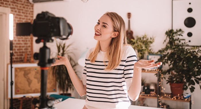 girl smiling for the camera digital influencer shooting at home