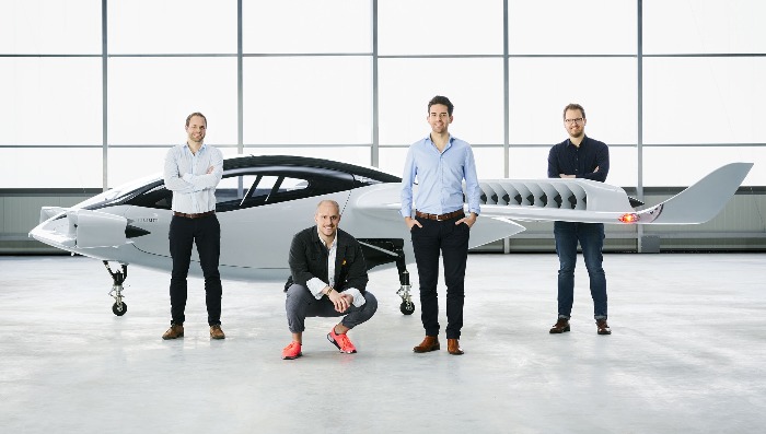 team of engineers demonstrating Lilium Jet flying car model