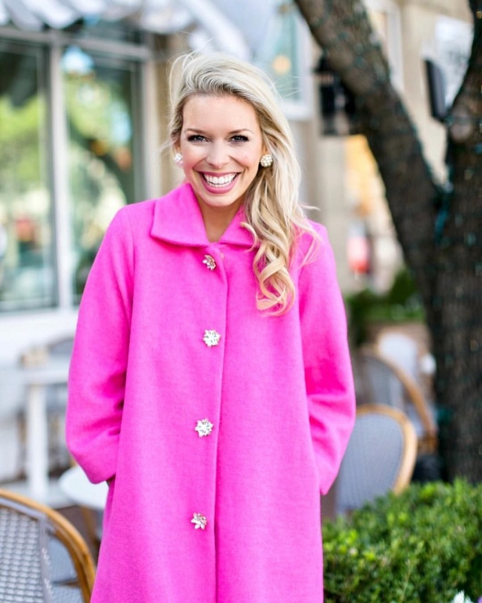 sarah hunt lifestyle influencer in a bright coat smiling outdoors