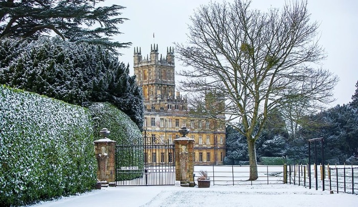 stately home Highclere castle in winter snowy background