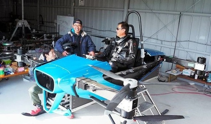 engineers testing blue toyota skydrive 