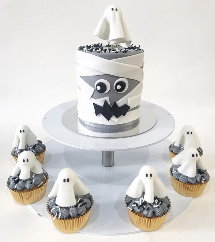 Halloween cake ideas white ghost cupcakes gray cake on a metal stand