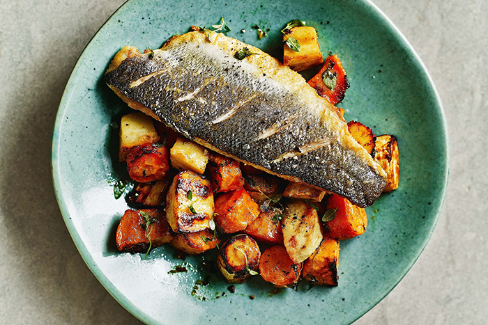 best food for fall fish with vegetables on a light blue plate