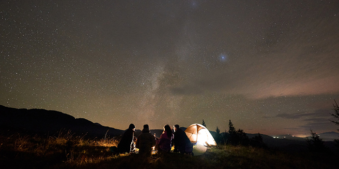 Best new hobbies for winter people gazing around a stent and fire stargazing