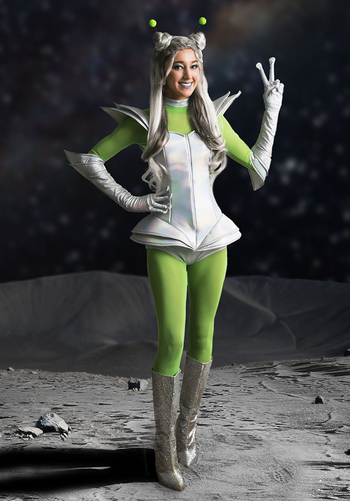 Halloween makeover a girl in a space costume with green pants and silver boots on a moon background