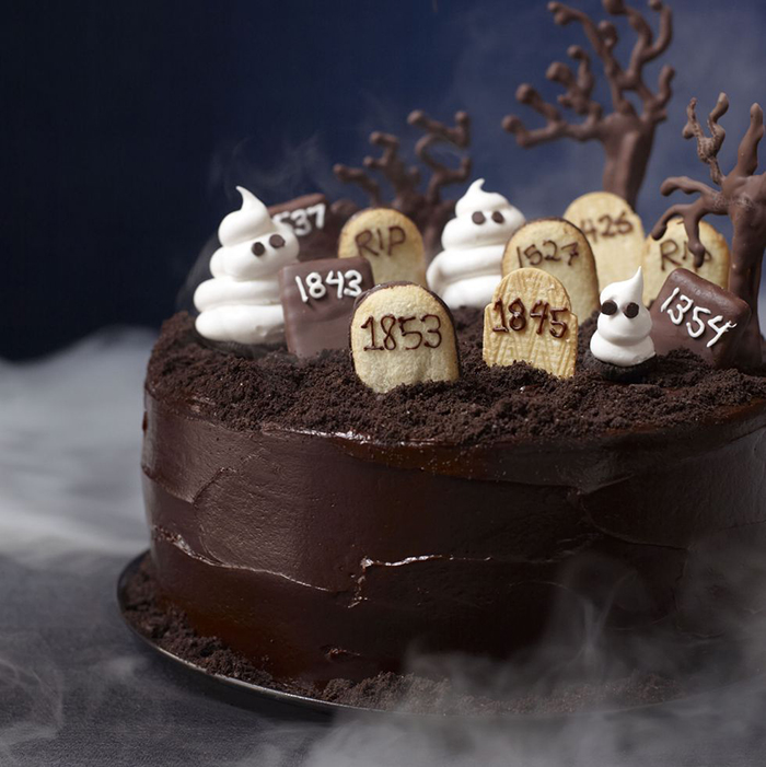 Halloween cake chocolate graveyard cake surrounded by mist and chocolate trees