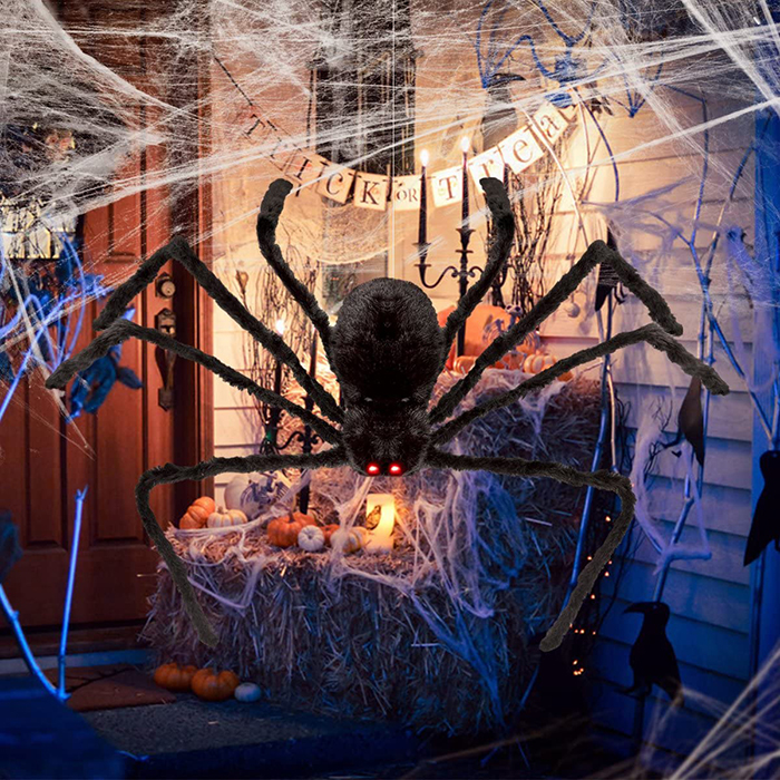 Halloween decor ideas front porch giant black spider and a spider web candles and pumpkins