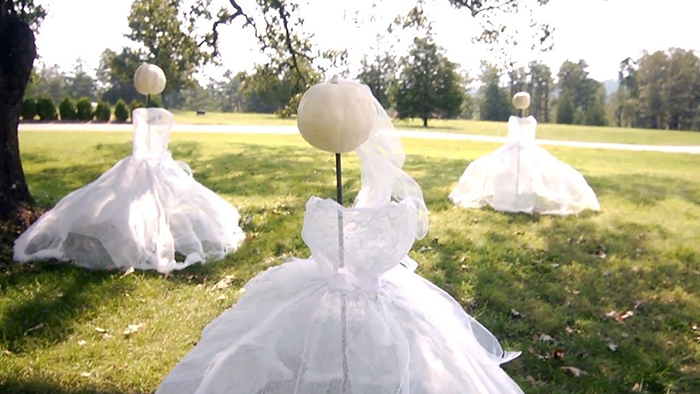 Halloween outdoor ideas white pumpkin heads white dresses ghosts on a lawn