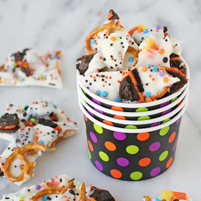 Halloween treats in cardboard cups pretzels and white chocolate